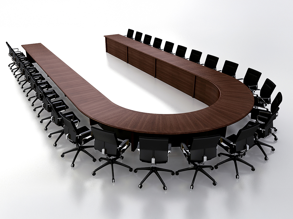 Large custom U-shaped conference room table with deep, dark wood veneer for videoconferencing including AV integration