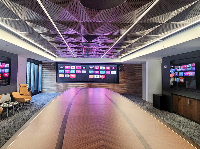 Intricate wood pattern boat conference table with sophisticated AV integration